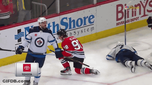 Hockey Player Number 9 Talking To Another Player GIF
