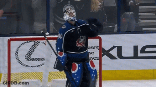Hockey Player Number 90 In Front Of Lexus Ad GIF