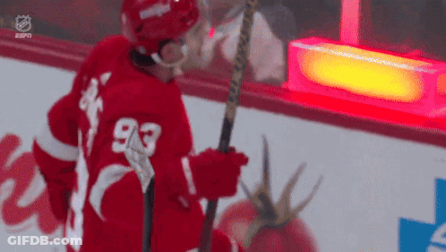 Hockey Player Number 93 Holding Stick GIF
