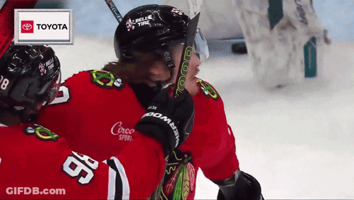 Hockey Player Number 98 Hugging Another Player GIF