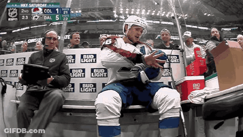 Hockey Player On Bench With Bud Light Ads GIF
