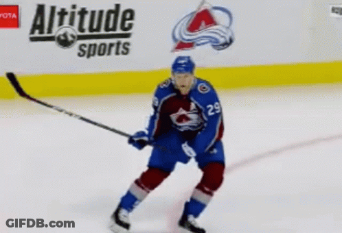 Hockey Player On Ice In Front Of Altitude Sports GIF