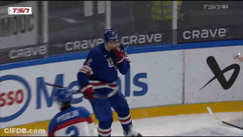 Hockey Player On Ice In Front Of Crave Sign GIF