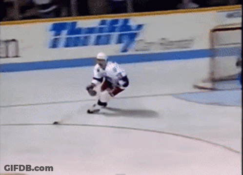 Hockey Player On Ice In Front Of Thrifty Sign GIF