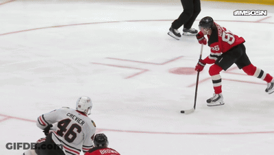 Hockey Player On Ice With Goal Banner GIF