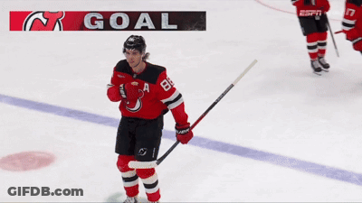 Hockey Player On Ice With Goal Banner GIF