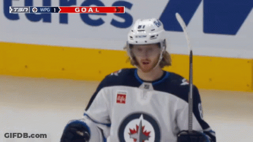 Hockey Player On Ice With Goal On Screen GIF
