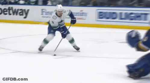 Hockey Player Skating In Front Of Bud Light Sign GIF