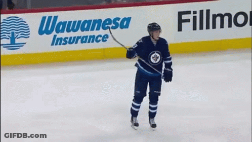 Hockey Player Skating In Front Of Wawanese Insurance Sign GIF