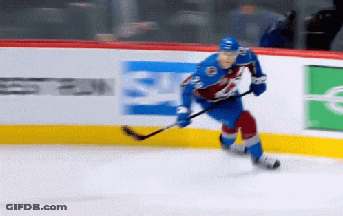 Hockey Player Skating On Ice GIF