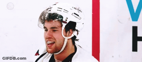 Hockey Player Smiling On Ice GIF
