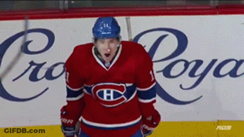 Hockey Player Standing Before Crown Royal Sign GIF