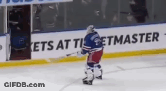 Hockey Player Standing In Front Of Ets At Ticketmaster Sign GIF
