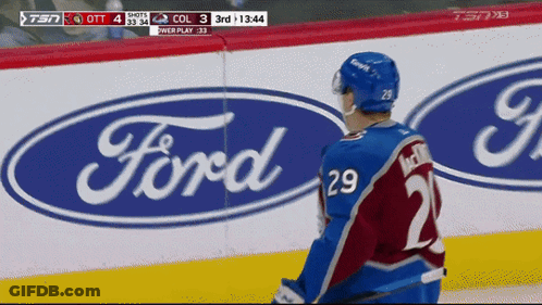 Hockey Player Standing In Front Of Ford Logo GIF