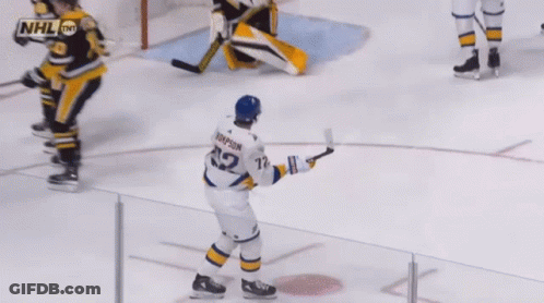 Hockey Player Thompson Holding Puck GIF