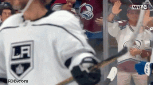 Hockey Player Waving In White Jersey GIF