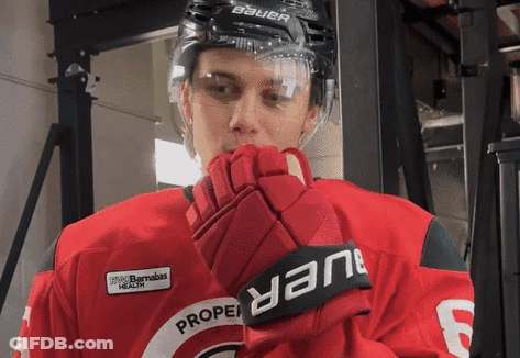Hockey Player Wearing Bauer Helmet And Gloves GIF