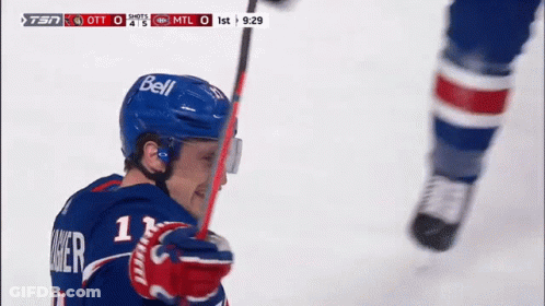 Hockey Player Wearing Bell Helmet Holding Stick GIF
