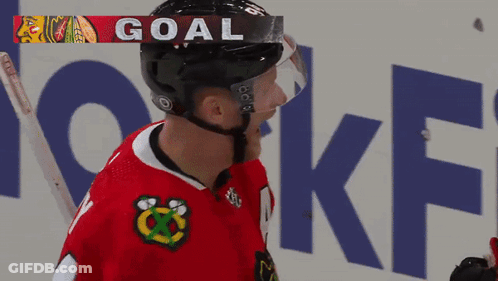 Hockey Player Wearing Helmet Saying Goal GIF