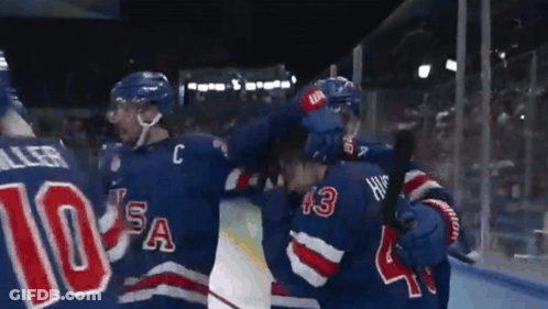 Hockey Player Wearing Number 10 Hugging GIF