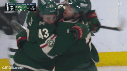 Hockey Player Wearing Number 43 Hugging GIF