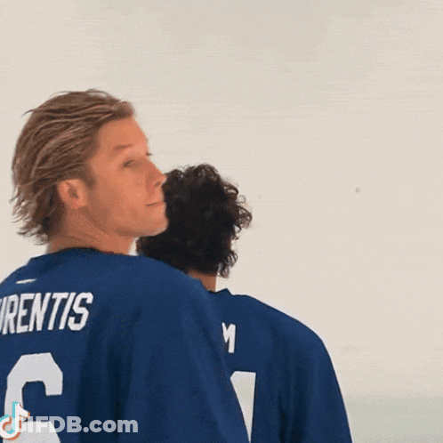 Hockey Player Wearing Warrior University Shirt GIF