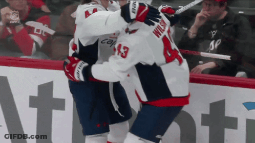 Hockey Player Wilson 13 Hugging Another Player GIF