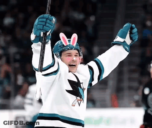 Hockey Player With Bunny Ears Holding Puck GIF