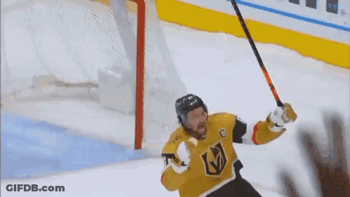 Hockey Player With C Holding Hockey Stick GIF