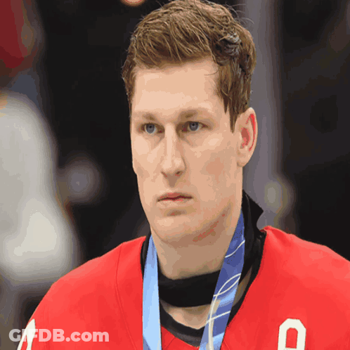 Hockey Player With Medal And Letter O On Jersey GIF