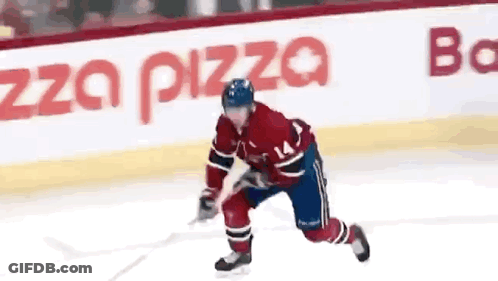 Hockey Player With Number 14 Skating On Ice GIF