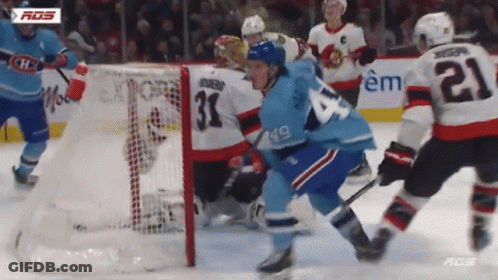 Hockey Player With Number 21 Playing Defense GIF