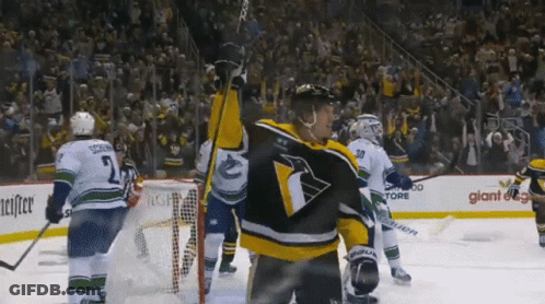 Hockey Player With Penguin Jersey On Ice GIF