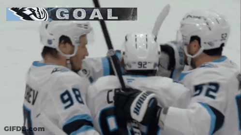 Hockey Players Celebrating Goal With Banner GIF