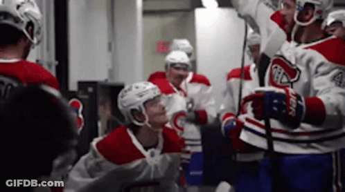 Hockey Players Huddled In Locker Room GIF