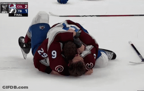 Hockey Players Lying On Ice After Final GIF
