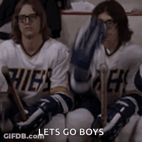Hockey Players On Bench One Covering Face GIF