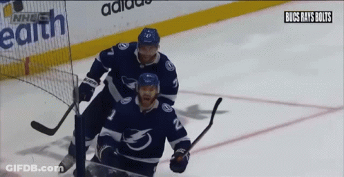 Hockey Players On Ice With NHL Logo GIF
