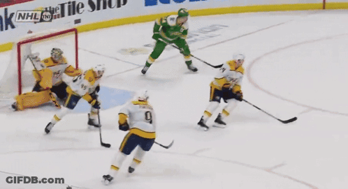 Hockey Players On The Ice With Us Bank And Ecolab Ads GIF