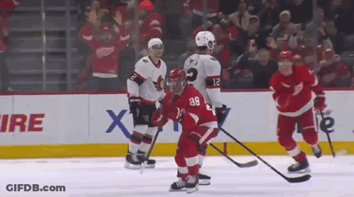 Hockey Players Playing On Ice GIF
