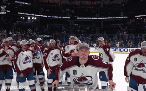 Hockey Players Posing With Trophy GIF