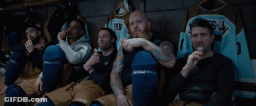 Hockey Players Sitting In Locker Room GIF