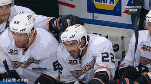 Hockey Players Sitting In Locker Room GIF