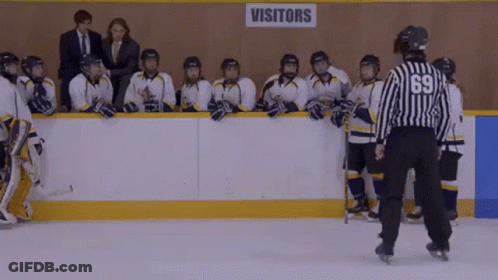 Hockey Players Standing In Front Of Visitors Sign GIF