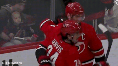 Hockey Players Standing On Rink GIF