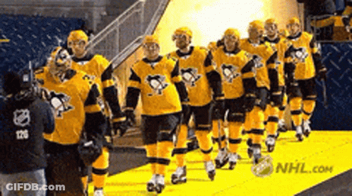 Hockey Players Walking Down Yellow Carpet With NHL.com GIF
