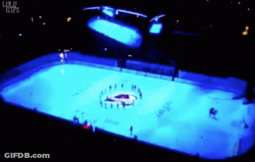 Hockey Rink Lit Up With Blue Lights GIF