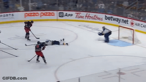 Hockey Rink With Tim Hortons And Pezzo Pizza Ads GIF