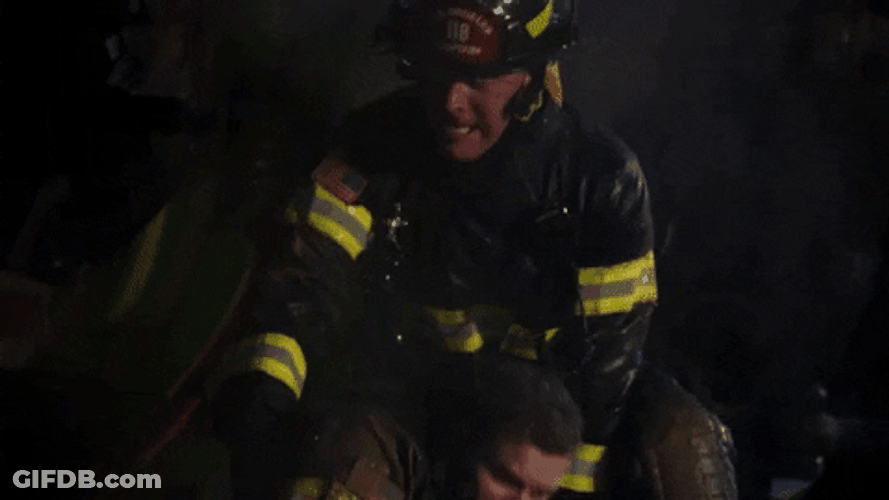 Holding Back Fire Fighter GIF