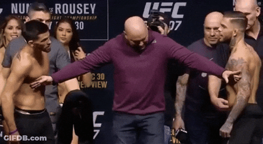Holding Back Men On Fight GIF
